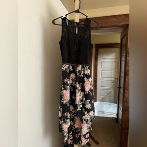 Laced top, asymmetrical dress with belt.